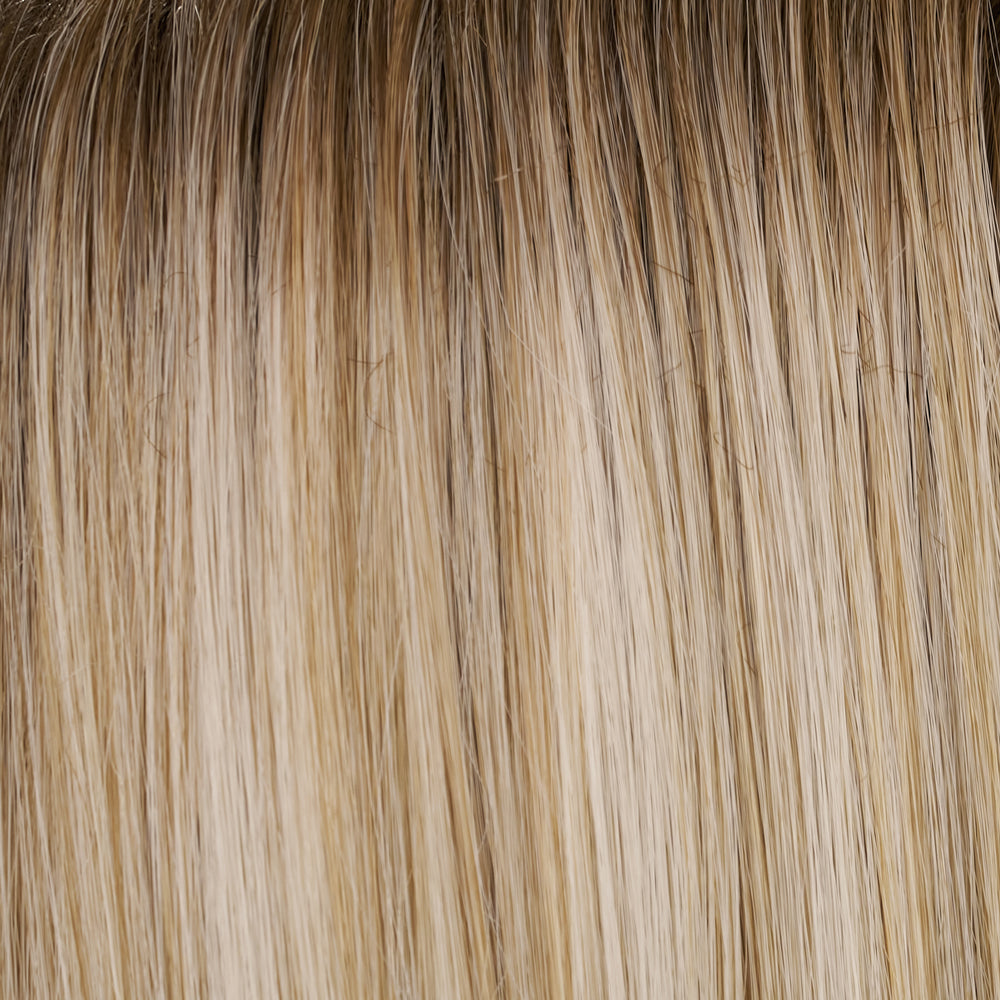 Close-up of blonde hair extensions with a gradient.