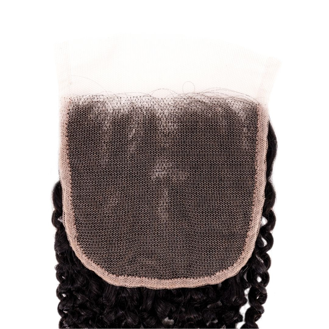 A magnified look at the lace of an Afro Kinky Curly Closure